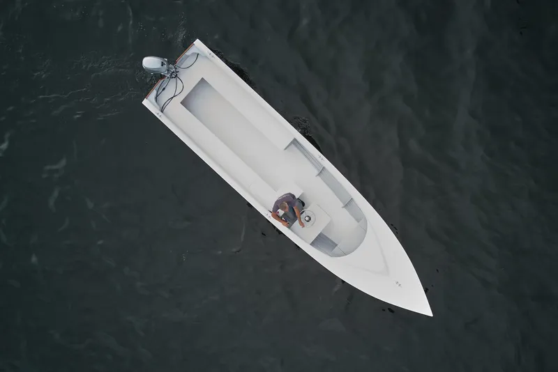 Slide: The Image of Aerial view of 2023 Custom Uffa Fox boat on dark water. - 3
