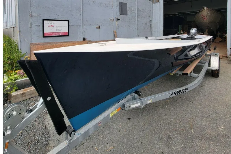 Slide: The Image of Custom 2023 Uffa Fox boat on trailer outside workshop. - 5