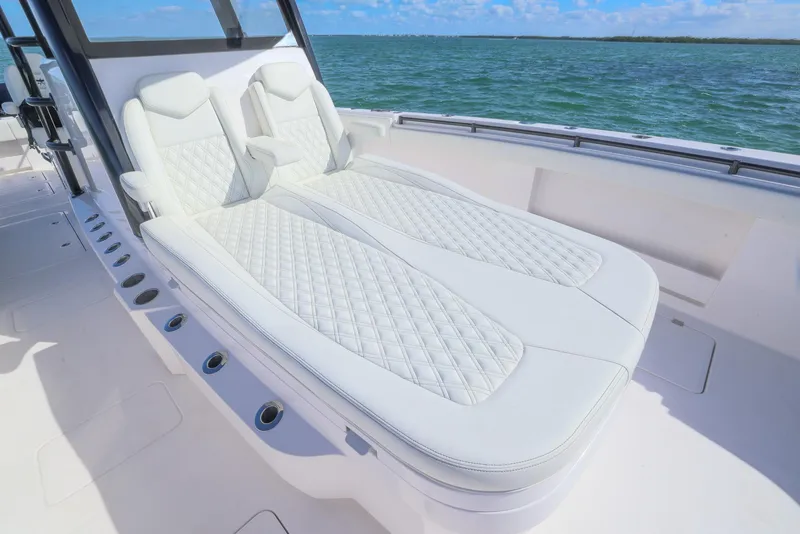 Slide: The Image of Luxurious seating on 2025 Invincible 35 Catamaran, featuring diamond-stitched upholstery, ocean view. - 14