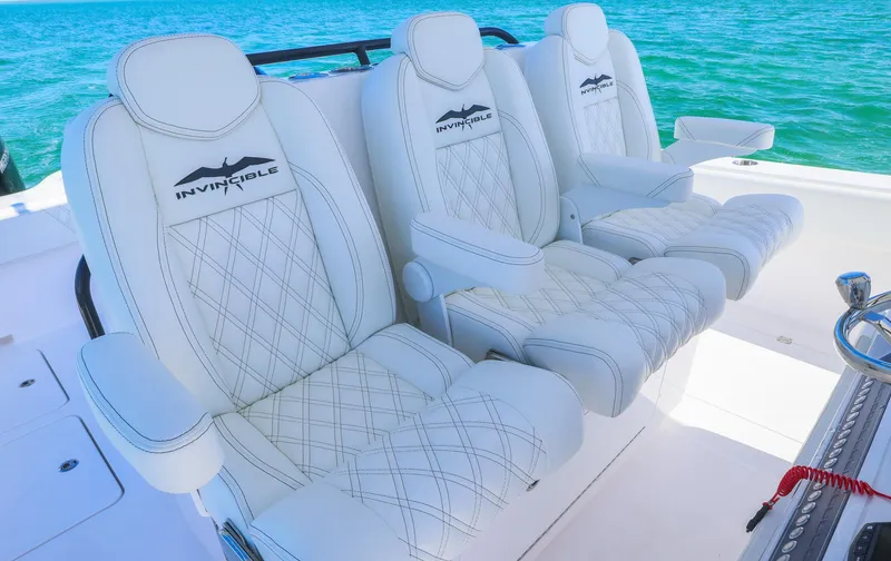 Slide: The Image of Luxurious seating on 2025 Invincible 35 Catamaran with ocean backdrop. - 22
