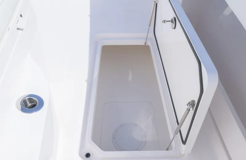 Slide: The Image of Open storage compartment on 2025 Invincible 35 Catamaran boat. - 24