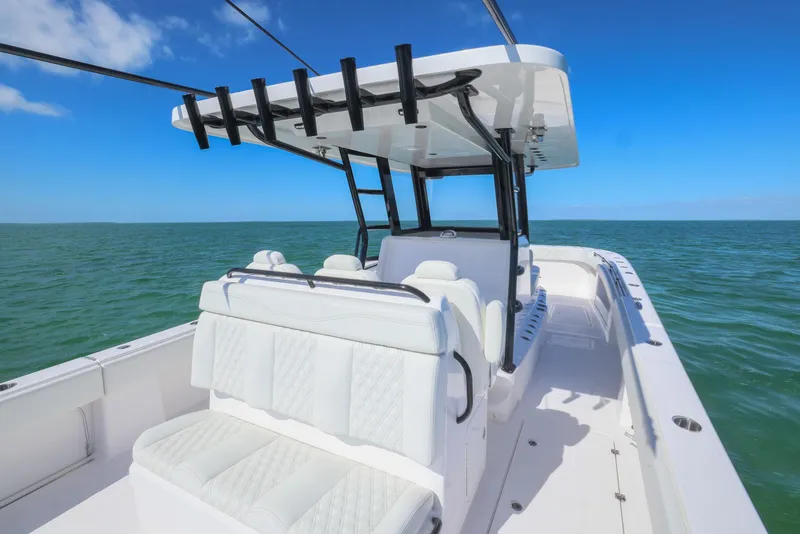 Slide: The Image of 2025 Invincible 35 Catamaran on open water, featuring sleek white seating and modern design. - 29