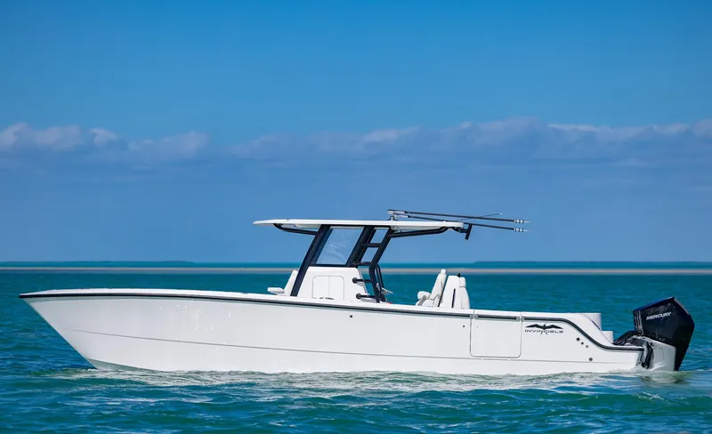 Slide: The Image of 2025 Invincible 35 Catamaran cruising on clear blue water under a sunny sky. - 3