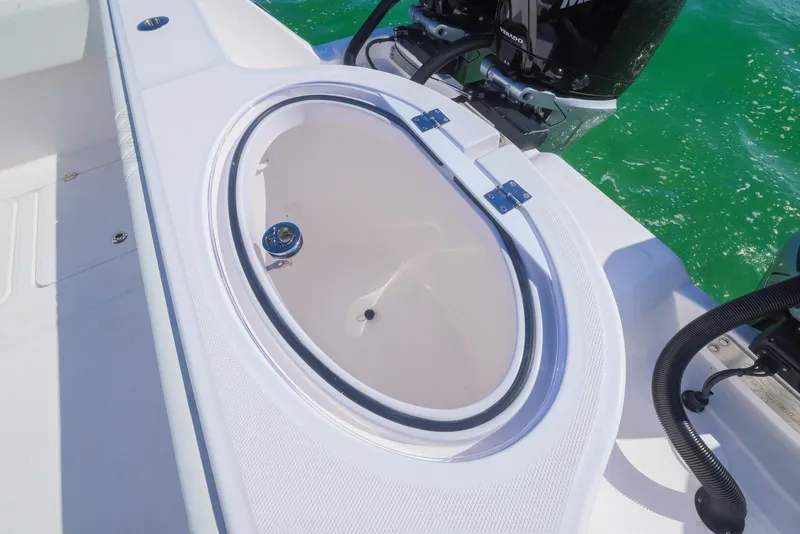 Slide: The Image of Invincible 35 Catamaran 2025 livewell on deck, with ocean backdrop. - 33