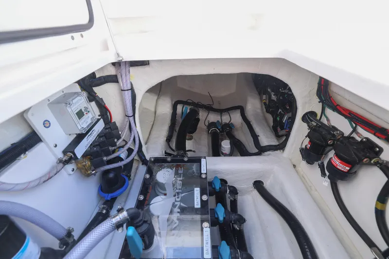 Slide: The Image of Engine compartment of 2025 Invincible 35 Catamaran, showcasing wiring and components. - 40