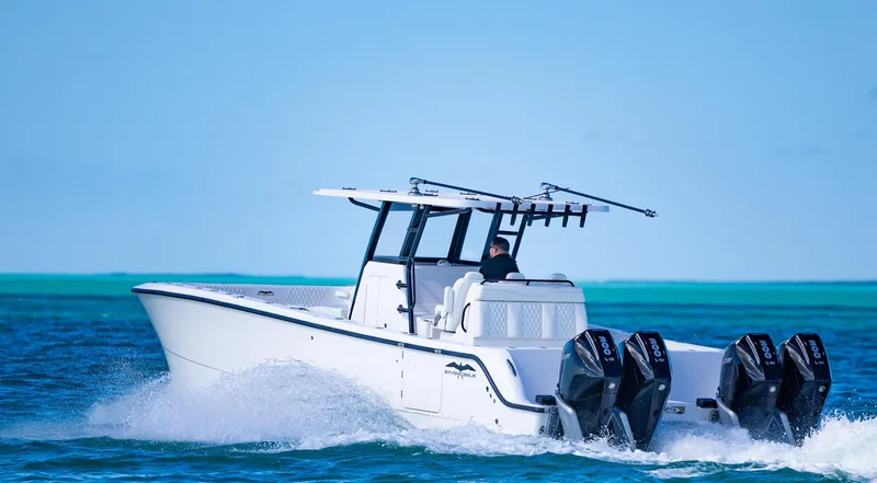 Slide: The Image of 2025 Invincible 35 Catamaran cruising on open water with four powerful engines. - 6