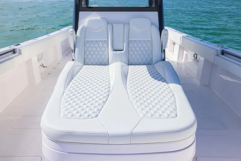 Slide: The Image of Luxurious seating on 2025 Invincible 35 Catamaran, featuring elegant white upholstery. - 9