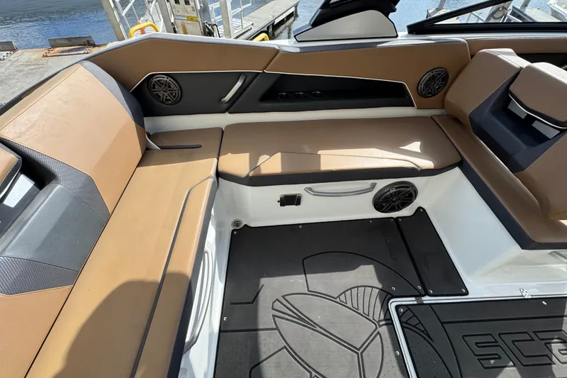 Slide: The Image of 2022 Scarab 285 ID boat interior with tan seating and black accents. - 28