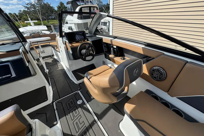 Slide: The Image of 2022 Scarab 285 ID boat interior with modern dashboard and seating. - 30