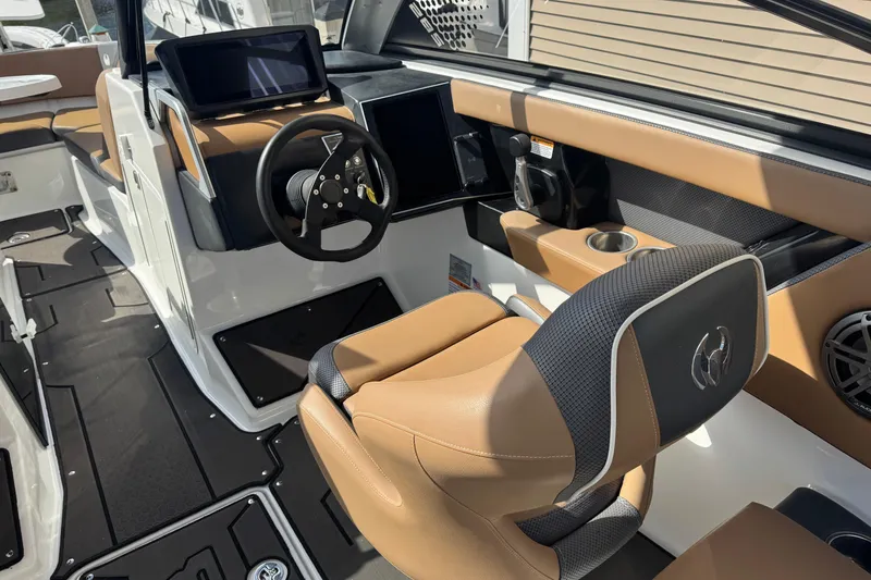 Slide: The Image of 2022 Scarab 285 ID boat interior with modern dashboard and tan seating. - 31