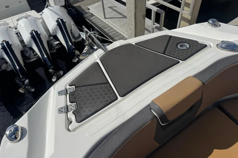 Slide: The Image of 2022 Scarab 285 ID boat with sleek deck design and powerful outboard engines. - 38