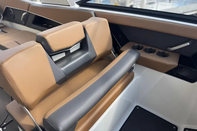 Slide: The Image of Luxurious interior of 2022 Scarab 285 ID boat with brown seating and cup holders. - 50