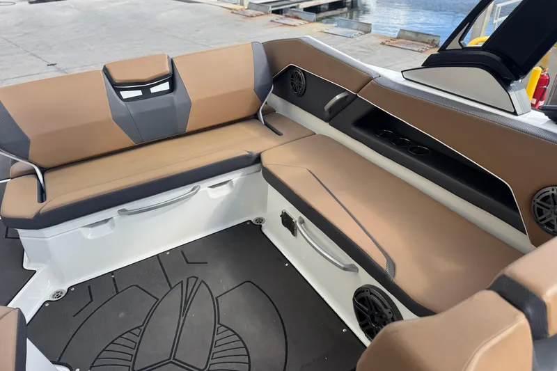 Slide: The Image of 2022 Scarab 285 ID boat interior with tan seating and black accents. - 53