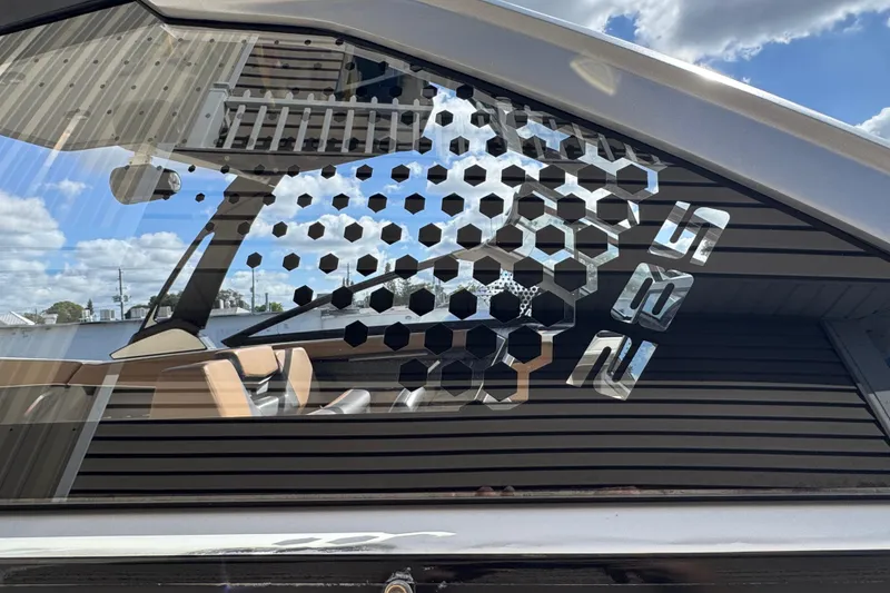 Slide: The Image of 2022 Scarab 285 ID boat with hexagonal window design and modern interior. - 7