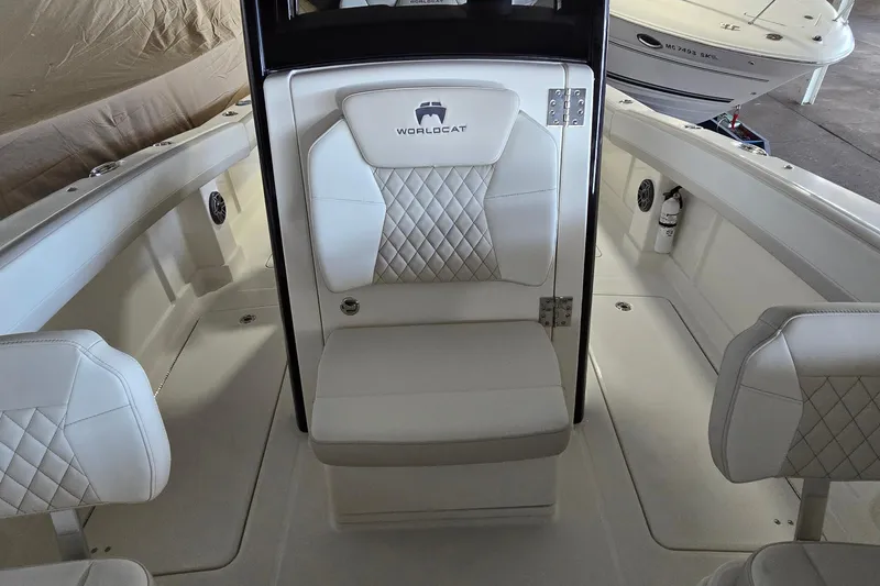 Slide: The Image of 2024 WorldCat 280 CC-X boat interior with white quilted seating and modern design. - 12