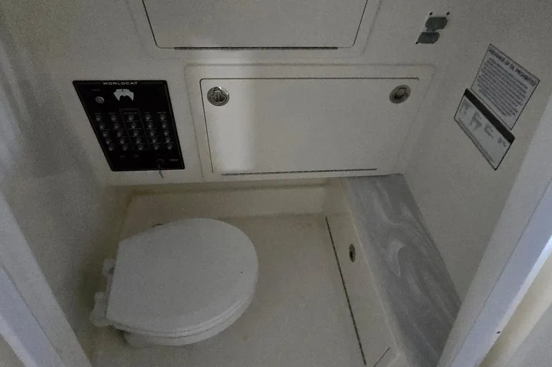 Slide: The Image of 2024 WorldCat 280 CC-X boat interior with toilet and control panel. - 14