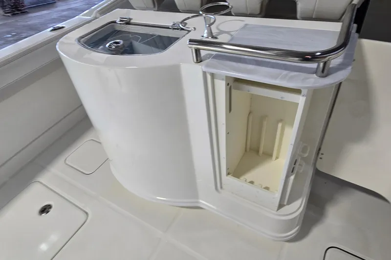 Slide: The Image of 2024 WorldCat 280 CC-X boat interior with storage compartment and sink. - 28