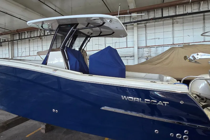 Slide: The Image of 2024 WorldCat 280 CC-X boat in a warehouse, featuring a sleek blue design. - 4