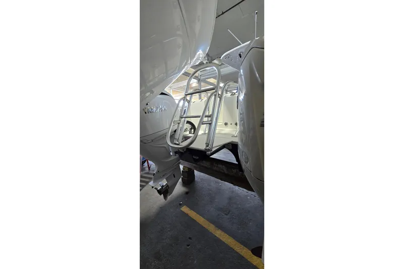 Slide: The Image of 2024 WorldCat 280 CC-X boat with ladder in a garage setting. - 40