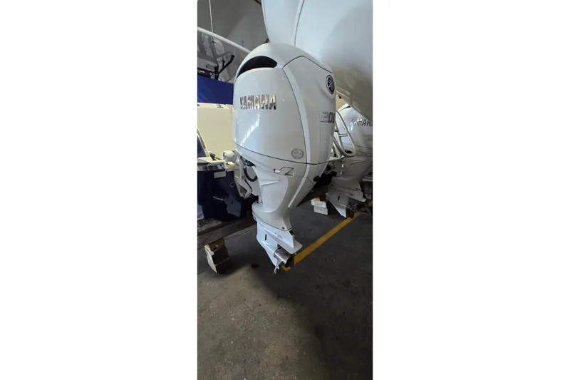 Slide: The Image of 2024 WorldCat 280 CC-X boat with Yamaha outboard motor in a garage. - 42