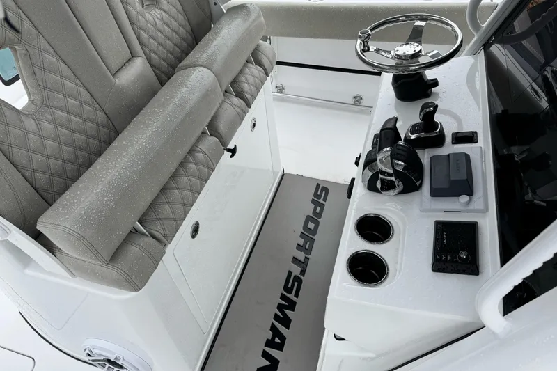 Slide: The Image of 2021 Sportsman Open 322 Center Console with wet seating and modern controls. - 16
