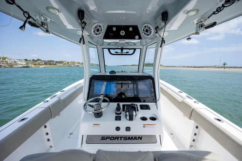 Slide: The Image of 2021 Sportsman Open 322 Center Console boat interior with steering wheel and controls. - 30