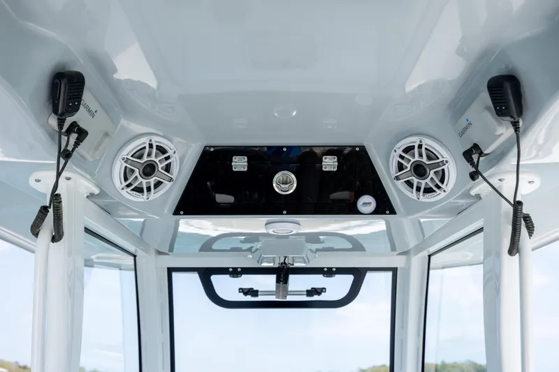Slide: The Image of 2021 Sportsman Open 322 Center Console boat interior with speakers and communication devices. - 32