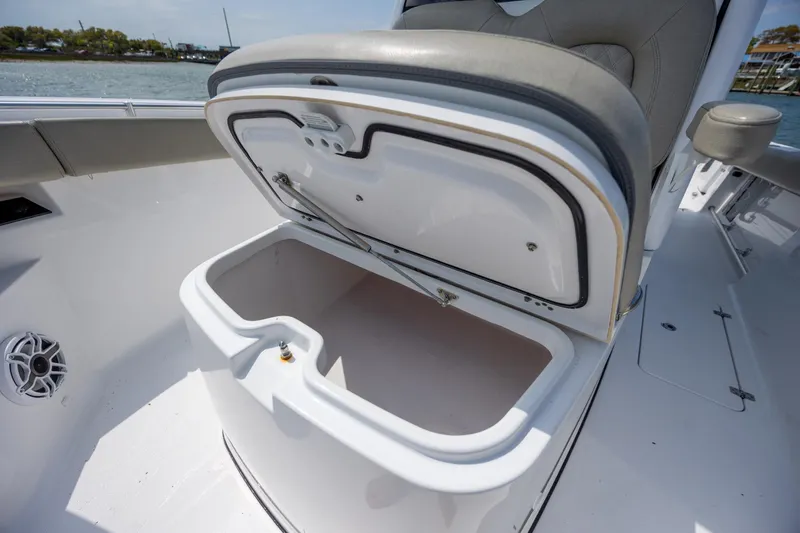 Slide: The Image of Open storage compartment on 2021 Sportsman Open 322 Center Console boat. - 41