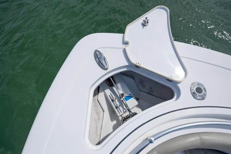 Slide: The Image of 2021 Sportsman Open 322 Center Console anchor compartment on calm water. - 42