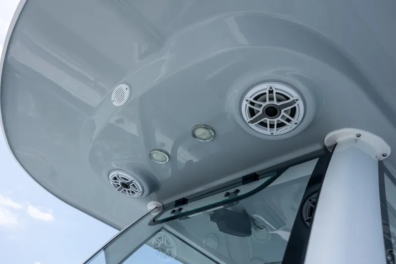 Slide: The Image of 2021 Sportsman Open 322 Center Console boat speakers and lights on T-top. - 44