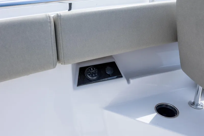 Slide: The Image of 2021 Sportsman Open 322 Center Console boat interior detail with seating and control panel. - 45