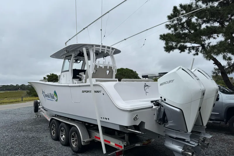 Slide: The Image of 2021 Sportsman Open 322 Center Console boat on trailer with twin Mercury engines. - 6