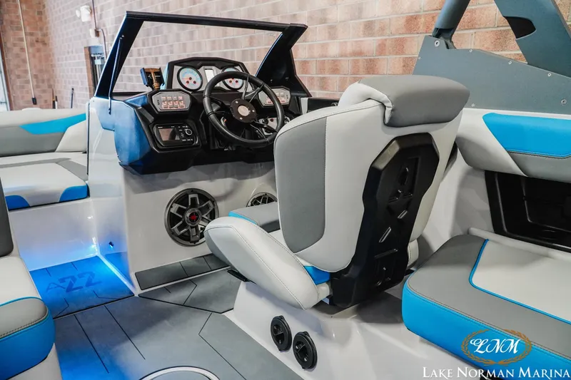 Slide: The Image of 2021 Axis A22 boat interior with modern dashboard and seating at Lake Norman Marina. - 11
