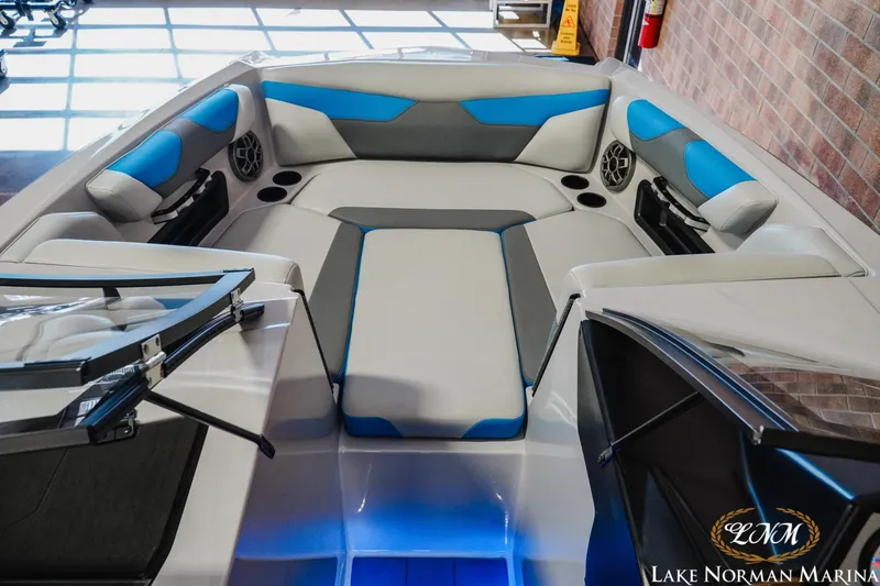 Slide: The Image of 2021 Axis A22 boat interior with blue and gray seating at Lake Norman Marina. - 13