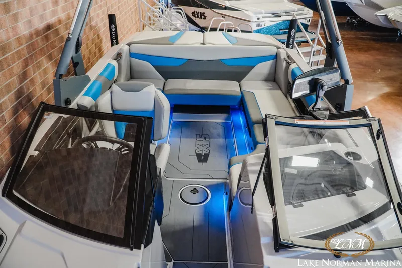Slide: The Image of 2021 Axis A22 boat interior with blue accents at Lake Norman Marina. - 14