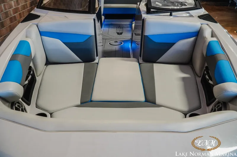Slide: The Image of 2021 Axis A22 boat interior with blue and gray seating at Lake Norman Marina. - 4