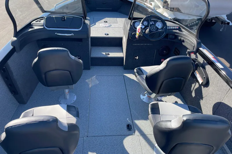 Slide: The Image of 2026 Crestliner 2050 Authority boat interior with four seats and steering console. - 11