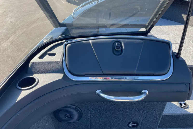 Slide: The Image of 2026 Crestliner 2050 Authority boat dashboard with storage compartment and cup holder. - 12