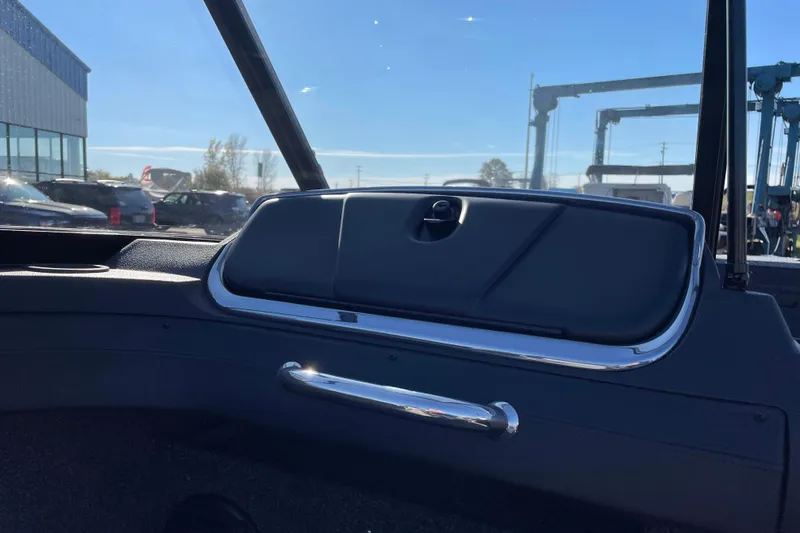 Slide: The Image of 2026 Crestliner 2050 Authority boat dashboard with sleek design and chrome accents. - 13