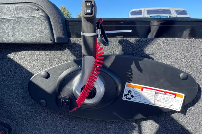 Slide: The Image of Control panel of 2026 Crestliner 2050 Authority boat with red safety lanyard. - 15