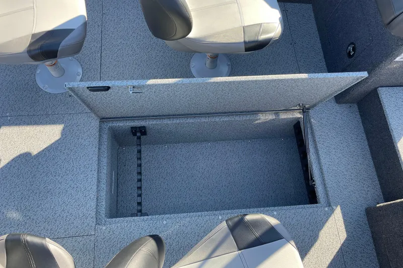 Slide: The Image of 2026 Crestliner 2050 Authority boat interior with open storage compartment and seating. - 17