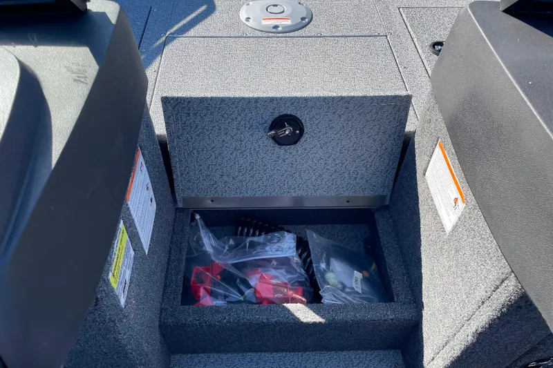 Slide: The Image of 2026 Crestliner 2050 Authority boat storage compartment with accessories in plastic bags. - 18