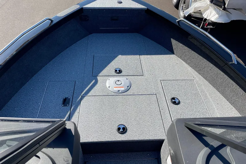 Slide: The Image of 2026 Crestliner 2050 Authority boat deck with storage compartments and sleek design. - 19