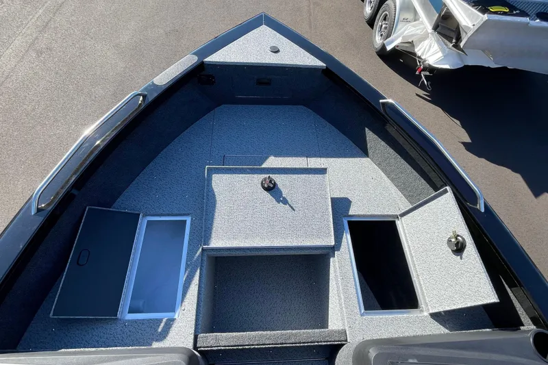 Slide: The Image of 2026 Crestliner 2050 Authority boat deck with open storage compartments. - 20