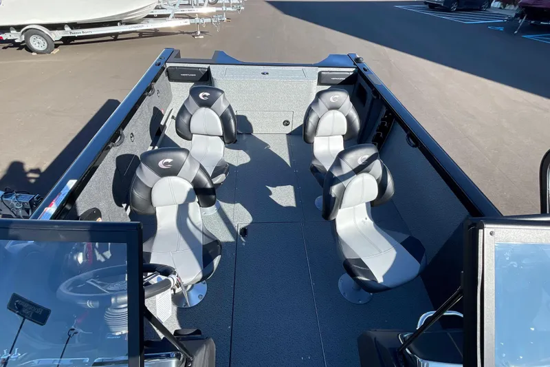 Slide: The Image of 2026 Crestliner 2050 Authority boat interior with four black and gray seats. - 21