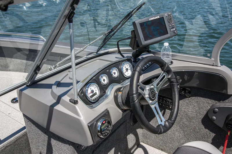 Slide: The Image of Manufacturer Provided Image: 2025 Crestliner 2050 Authority boat dashboard with steering wheel and navigation system. - 28