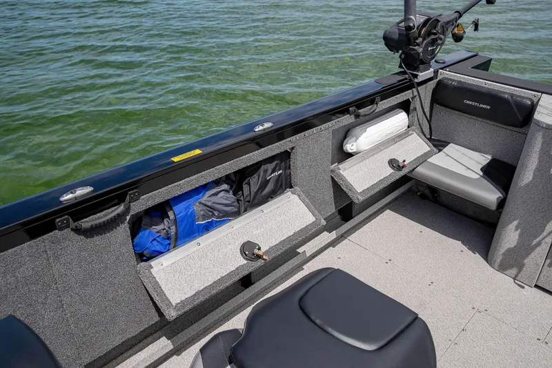 Slide: The Image of Manufacturer Provided Image: Crestliner 2050 Authority 2025 boat interior with storage compartments and seating on water. - 30