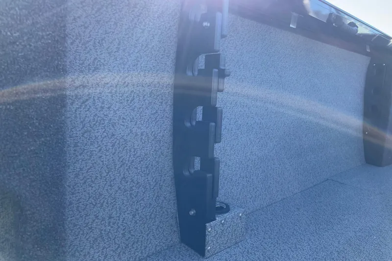 Slide: The Image of Interior view of 2026 Crestliner 2050 Authority boat with textured surface and sunlight reflection. - 8