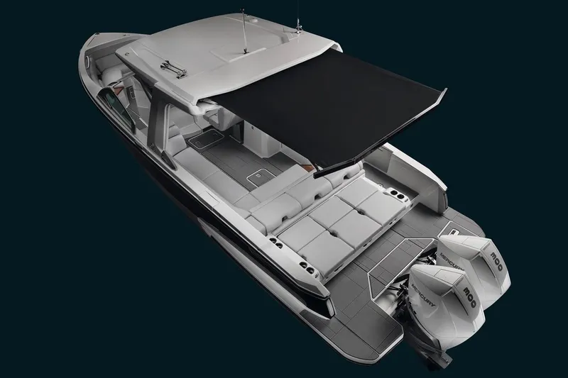 Slide: The Image of 2023 Aviara AV32 OB boat cruising on a scenic waterfront with houses in the background. - 1