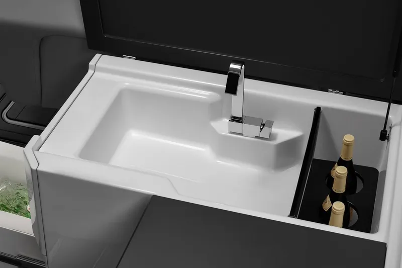 Slide: The Image of 2023 Aviara AV32 OB boat with dual outboard engines on water. - 11